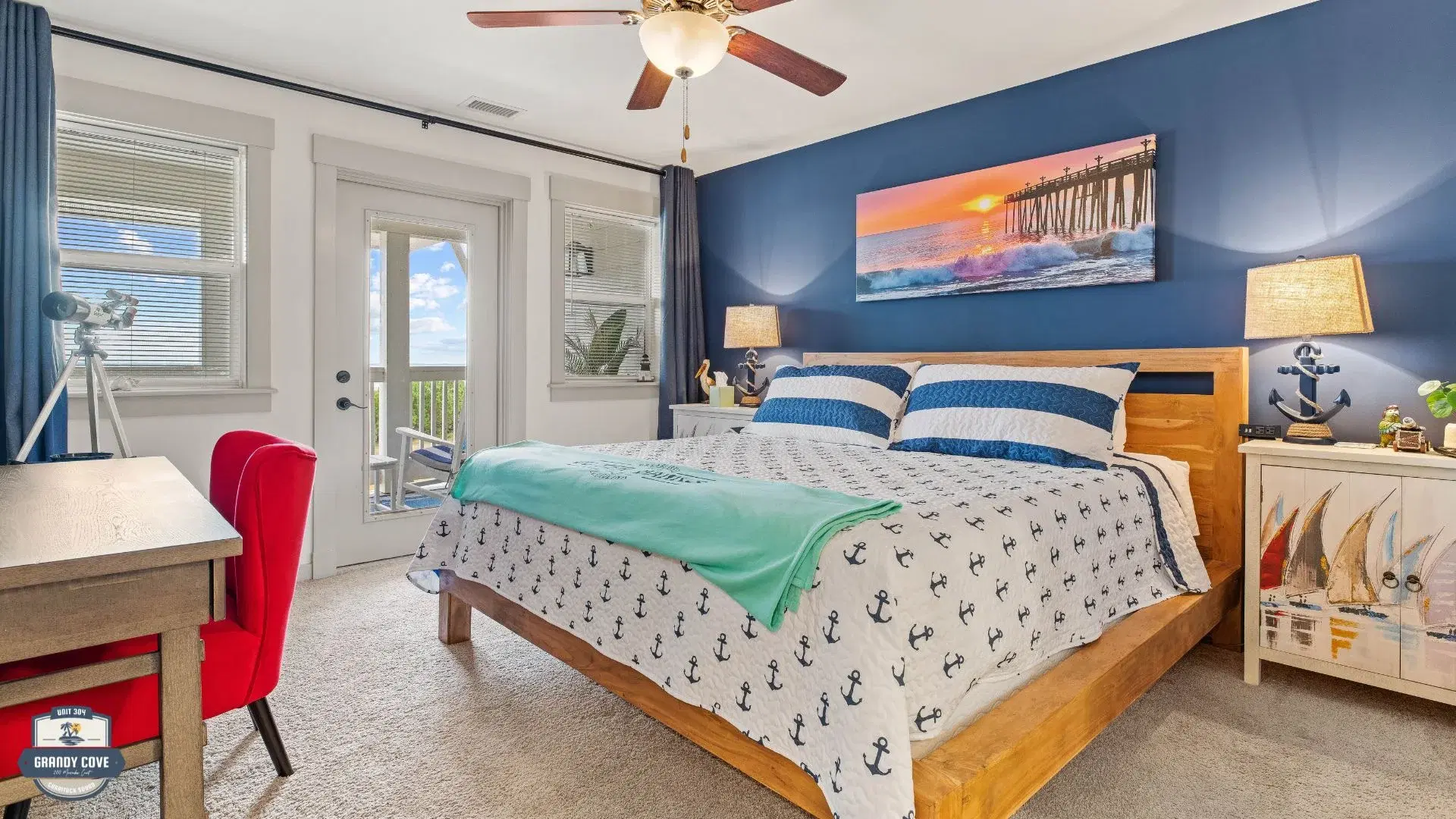 Grandy Cove bedroom with navy accent wall
