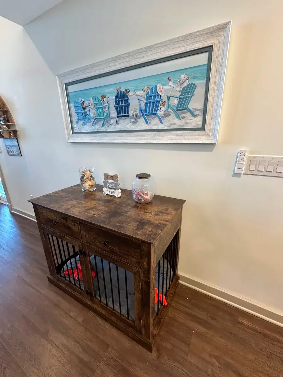 Dog feeding station with stainless bowls and welcome sign