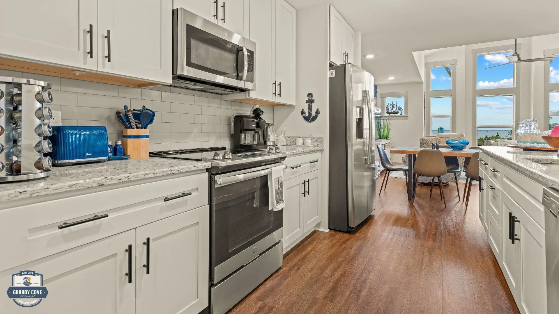 Grandy Cove kitchen with stainless appliances and granite countertops
