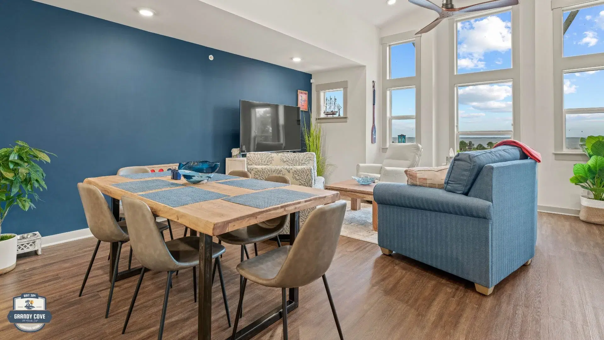 Grandy Cove living and dining room with TV and water views