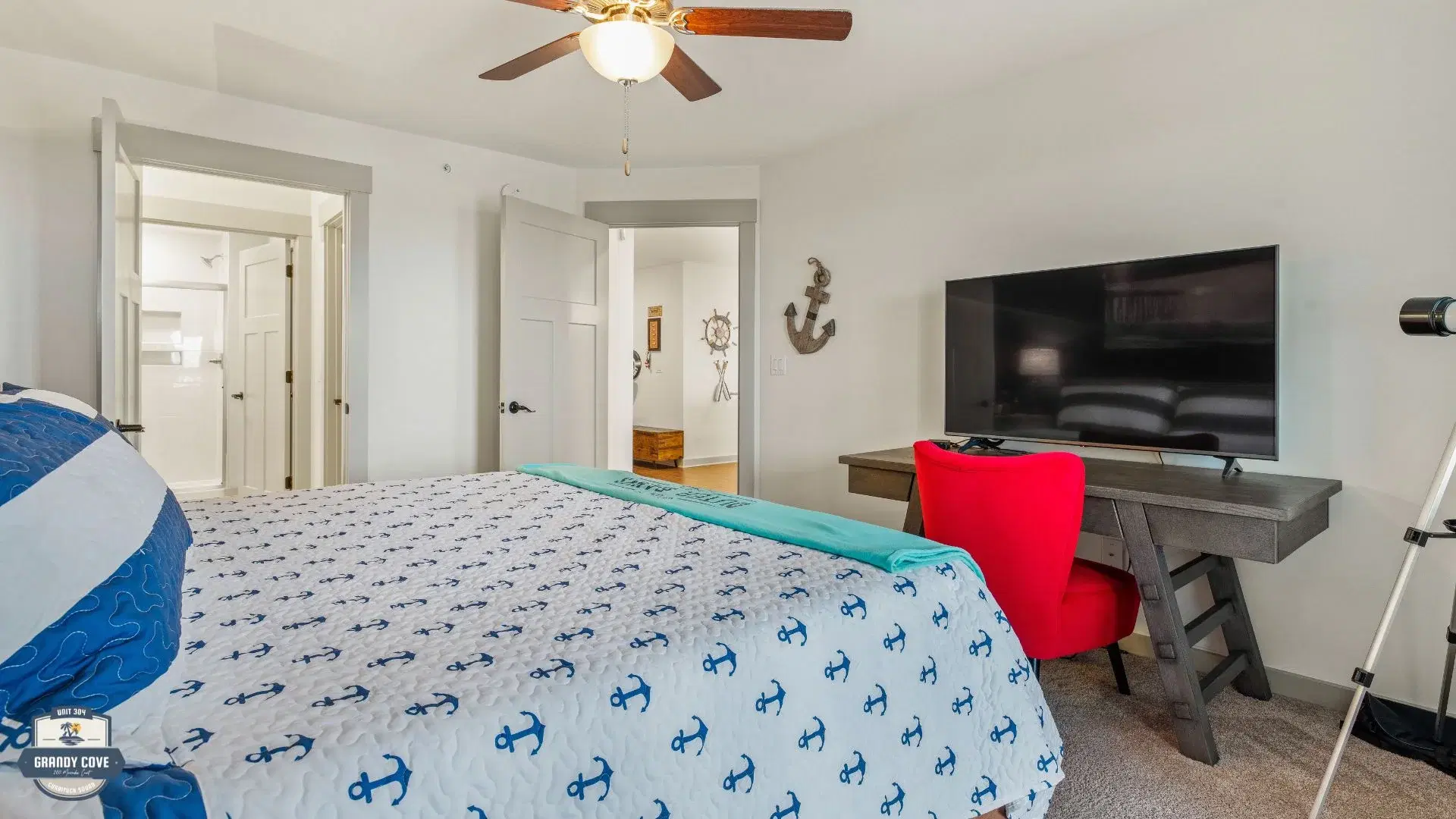 Grandy Cove master bedroom with king bed and nautical décor