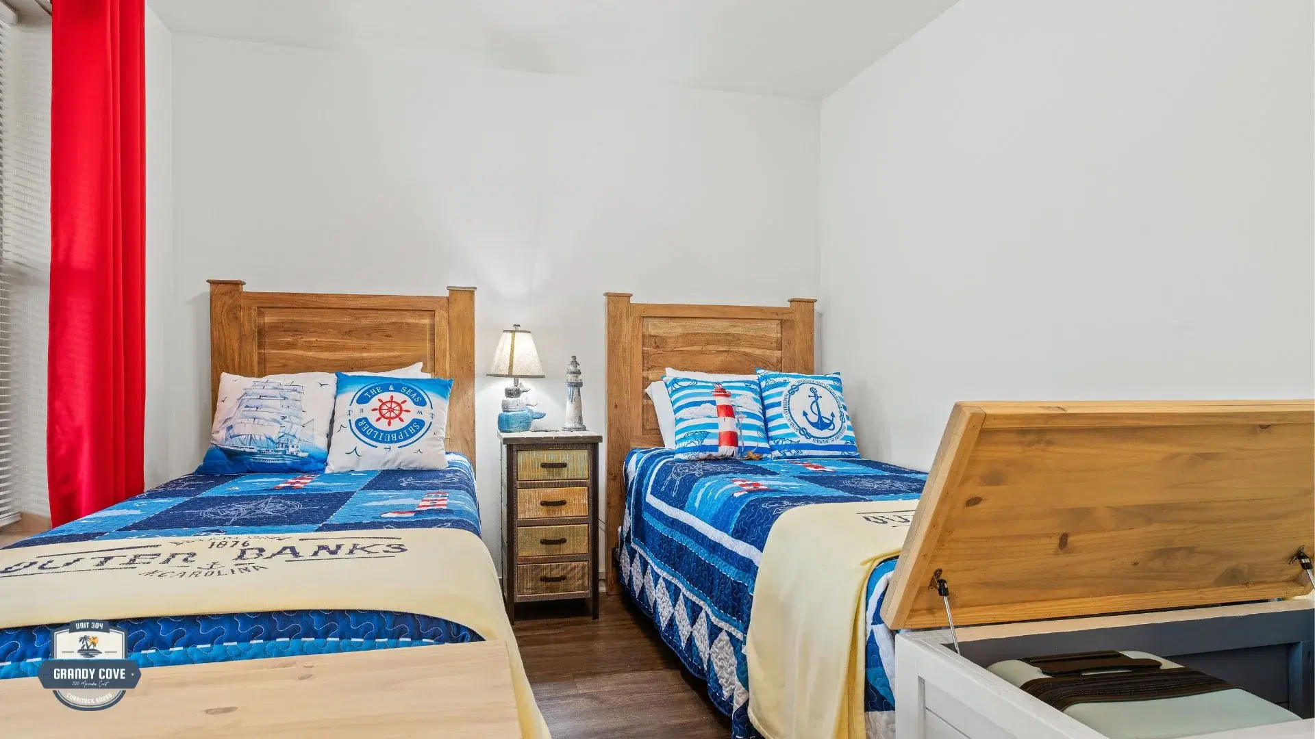 Grandy Cove third bedroom with two twin beds and nautical décor